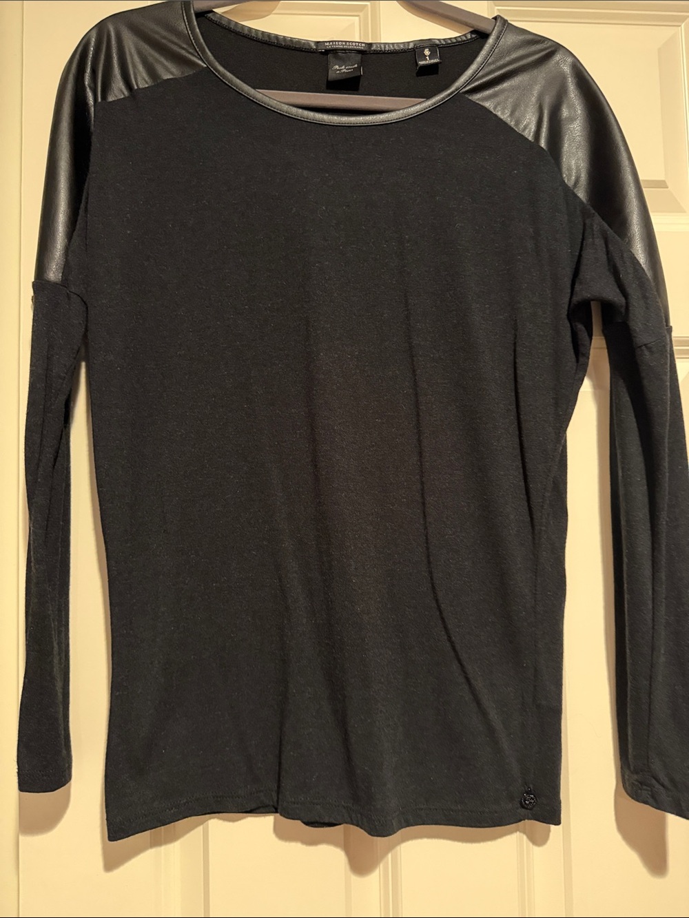 Women’s Black Long Sleeve Top with Leather Shoulders and Trim.